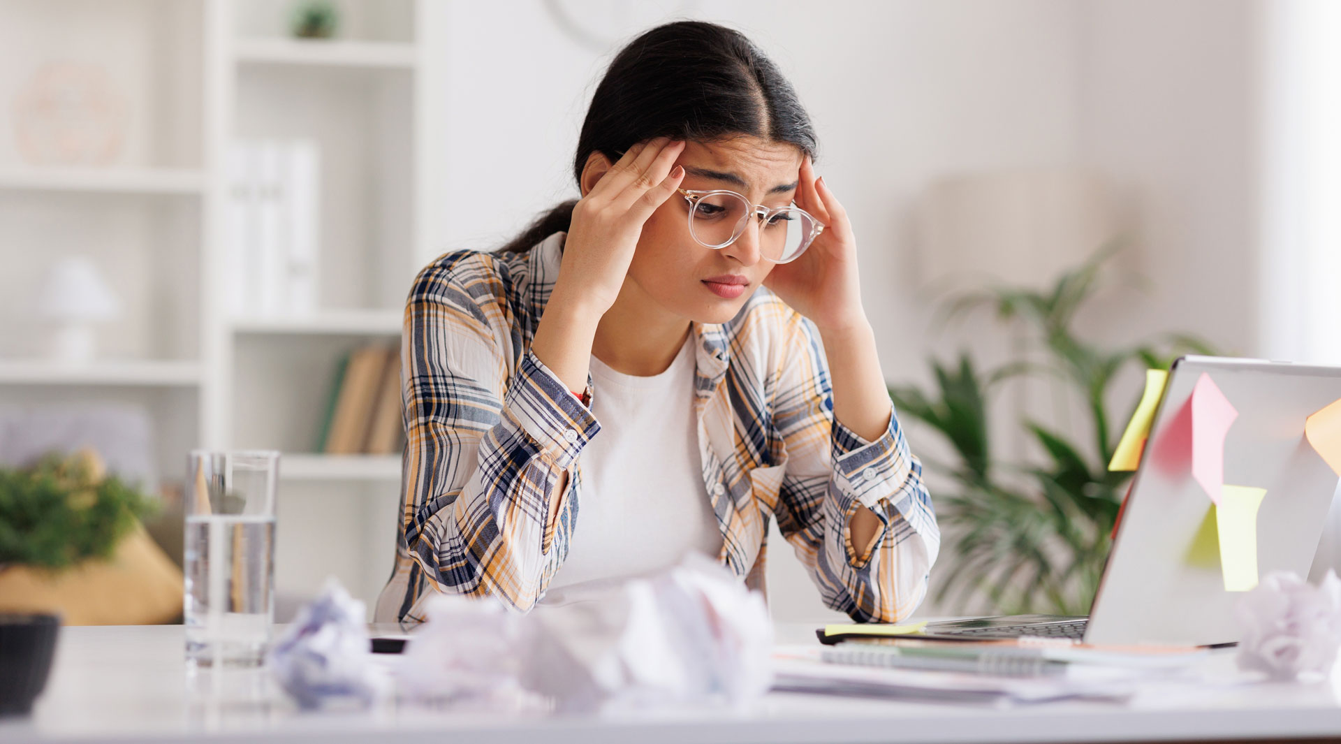 Stressed high school student feeling anxious about SAT or ACT test preparation