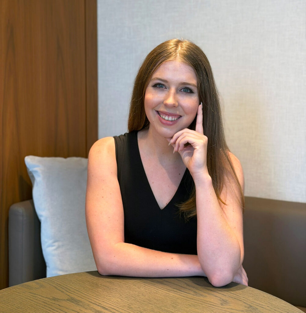 Grace Dunn seated thoughtfully — answering common questions about SAT, ACT, and PSAT tutoring at Crownridge Coaching