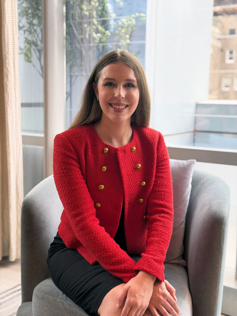 Grace Dunn seated with a warm smile — approachable and elite one-on-one SSAT tutor at Crownridge Coaching
